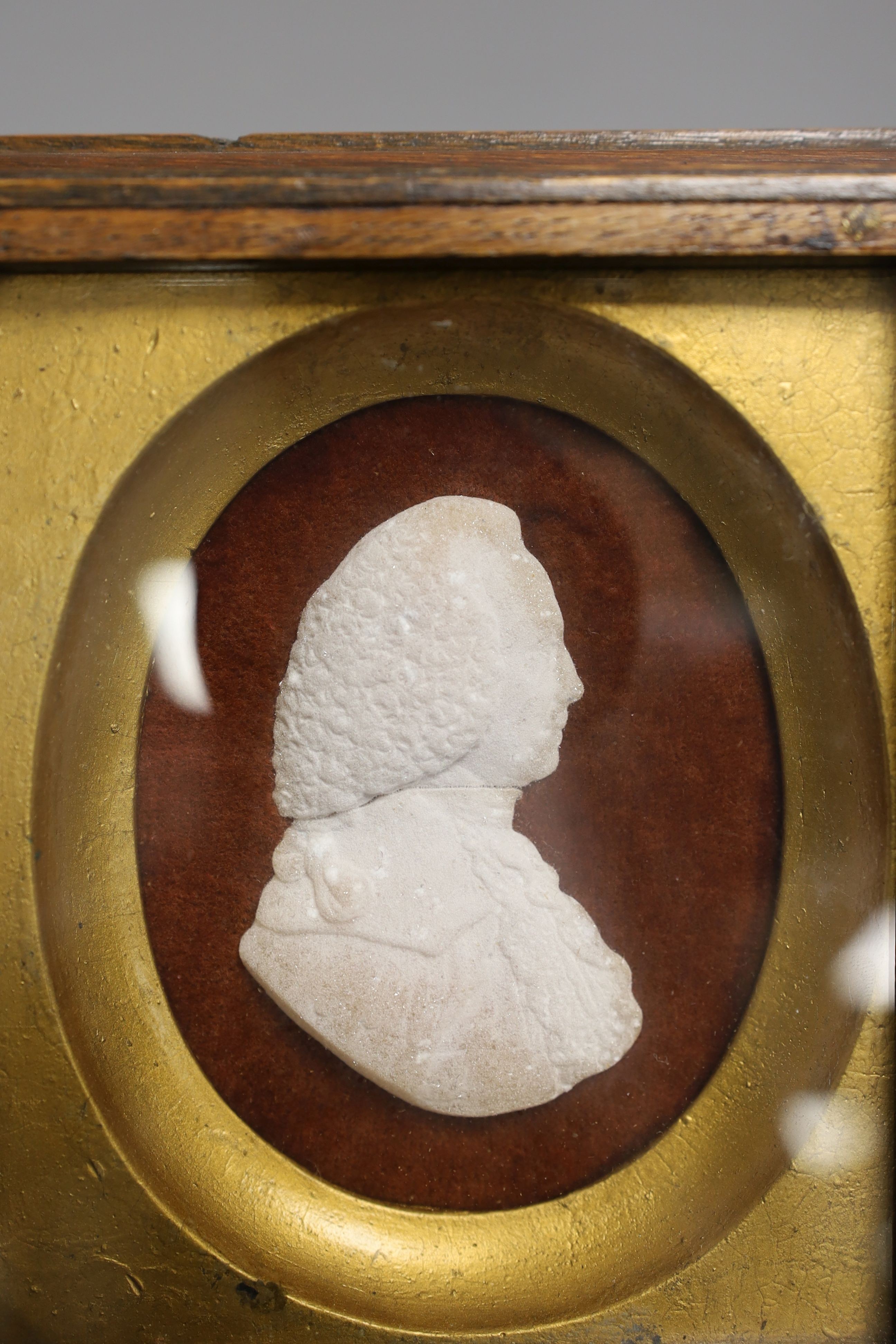 A crystalline stone relief portrait plaque of a gentleman, indistinctly signed, 8cm